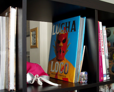 The entryway; the metal magazine holder was salvaged from the lobby of